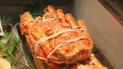 A bundle of king crab legs tied together with rubber bands.