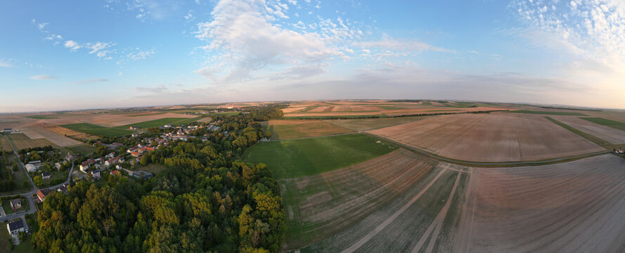 Bergnicourt, Rethel, Ardennes, Grand-Est, France, August, 28th, 2025, An expansive landscape features lush green fields, vibrant farm plots, and a clear blue sky in a stunning view