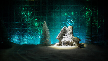 Christmas home decoration with snow and tree on a dark background with copy space. Selective focus. New Year attributes on background
