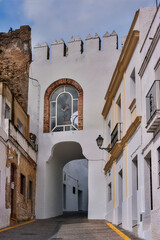 Arcos de La Frontera old town archway and statue