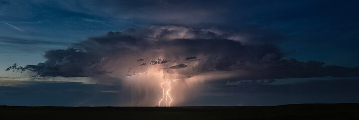 Storm with lightning over landscape