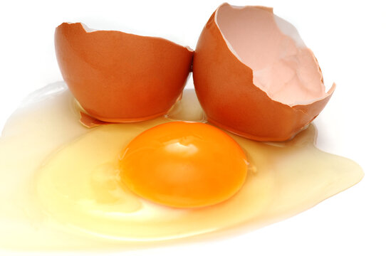 Broken egg with shells on white background