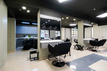 Beauty salon with sleek design and modern equipment offering various services in a calm setting