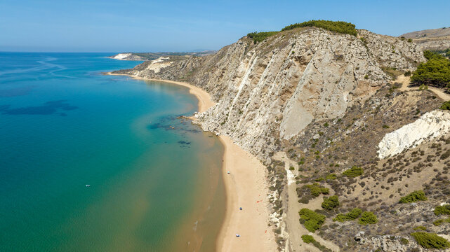 Aerial view of the beach and coastline of Siculiana Marina, in province of Agrigento, Sicily, Italy. It is a long sandy coast overlooking the Mediterranean Sea, whose waters are blue and turquoise.