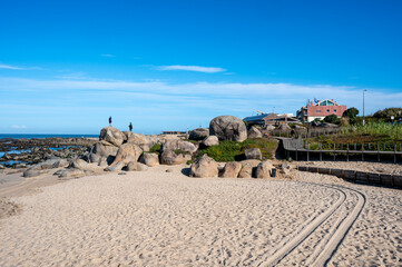 Obraz premium Praia de Canide, Canide Beach, on northern coast of Portugal in Vila Nova de Gaia under dramatic autumn cloudscape.