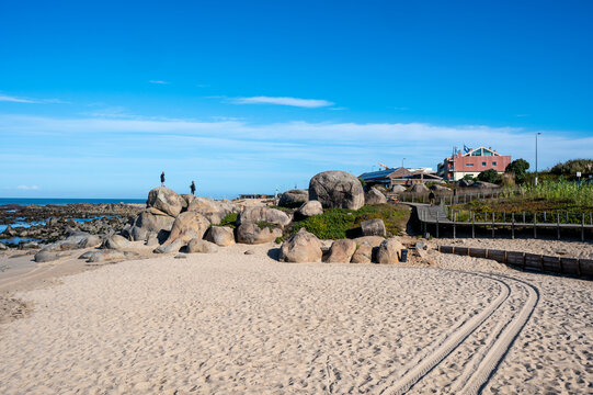 Praia de Canide, Canide Beach, on northern coast of Portugal in Vila Nova de Gaia under dramatic autumn cloudscape.