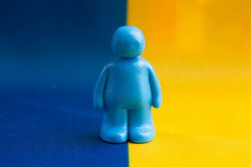 A blue man against the background of the Ukrainian flag