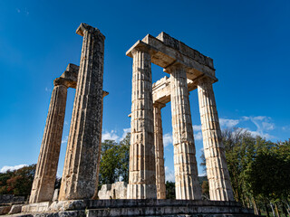 Naklejka premium The temple of the Nemean Zeus was built around 330 B.C. to serve the needs of the festival and the games. Three of the ancient culumns remain standing until today.