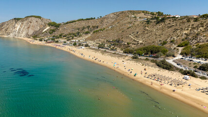 Aerial view of the beach and coastline of Siculiana Marina, in province of Agrigento, Sicily, Italy. It is a long sandy coast overlooking the Mediterranean Sea, whose waters are blue and turquoise.
