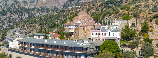Aerial of the Monastery of Archangel Michael on Thassos at golden hour, perched above a quiet...