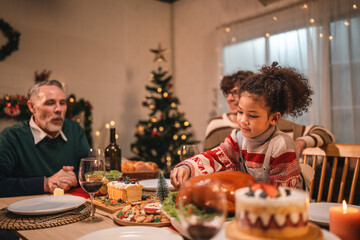 joyful family sharing a warm festive Christmas dinner creating happy memories together with laughter delicious food, spirit of love celebration togetherness around the holiday table