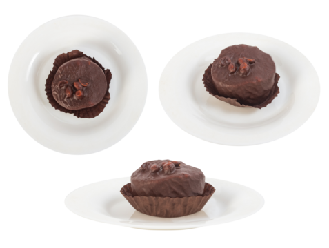 Isolated photo of chocolate cupcake with hazelnuts on plate on white background. Various angle view photo.