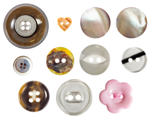 Isolated photo of various colored and shaped plastic and nacre decorative cloth buttons or rivets on white background.