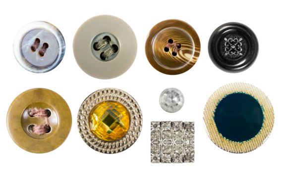 Isolated photo of various colored plastic and glass decorative cloth buttons or rivets with diamonds on white background.