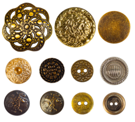 Isolated photo of various bronze and gold decorative cloth buttons or rivets on white background.