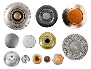 Isolated photo of various type metal cloth buttons or rivets on white background.