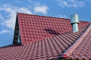 Red roof with a chimney on top