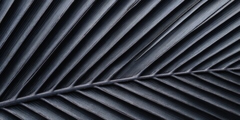 Detailed texture of a dark exotic leaf shows natural patterns and organic symmetry ideal for backgrounds or artistic representations