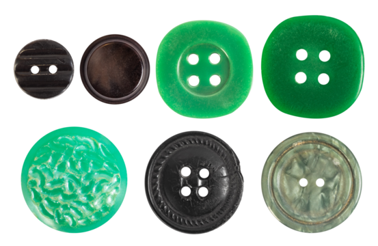 Isolated photo of various vintage green, khaki and black colored plastic decorative cloth buttons or rivets on white background.