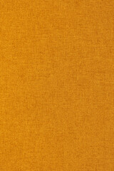 Fototapeta premium Close-up of a orange softshell waterproof outdoor hiking jacket background backdrop.