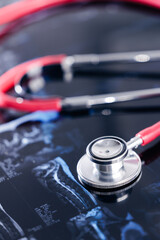Medical stethoscope on x-ray images highlighting healthcare and diagnosis concept, Mri scan of...