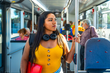 Young woman commuting on a bus for daily public transport