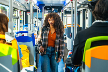 Young woman commuting on a public bus