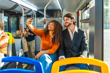Diverse couple taking selfie together on bus