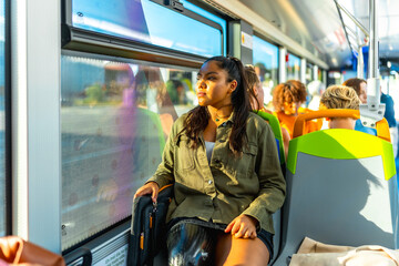 Young woman traveling on bus looking out window