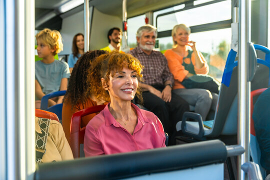 Diverse passengers traveling by bus enjoying public transport