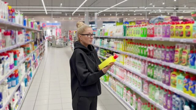 Choosing washing powder ,detergent,liquids at Groceries.