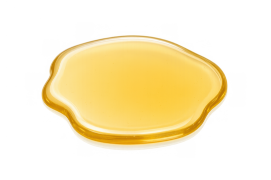 Golden viscous liquid puddle creating a sweet syrup or oil spill effect, isolated on a transparent background
