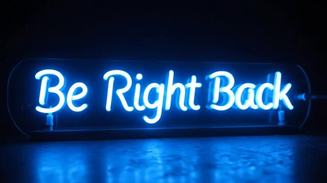 Blue neon sign with illuminated message stating 'Be Right Back' on a dark background.