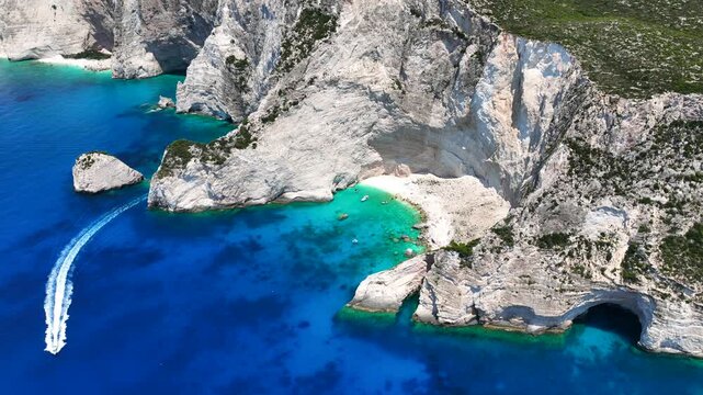 Aerial drone video of scenic turquoise beaches and white rock formations near small port of Porto Vromi an ideal place to start a boat tour near amazing North Zakinthos island, Ionian, Greece