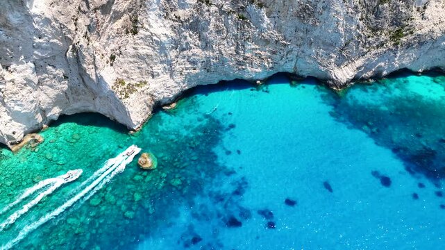 Aerial drone video of scenic turquoise beaches and white rock formations near small port of Porto Vromi an ideal place to start a boat tour near amazing North Zakinthos island, Ionian, Greece