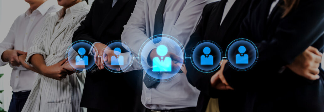 A diverse group of business professionals illustrates teamwork and networking in a modern office, symbolizing collaboration and success in today corporate environment. Trope - Powered by Adobe