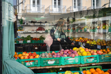 Woman choosing fresh fruit at a street market