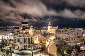 Aerial night View of Tallinn in winter with Alexander Nevsky Cathedral, roofs with snow, Christmas mood