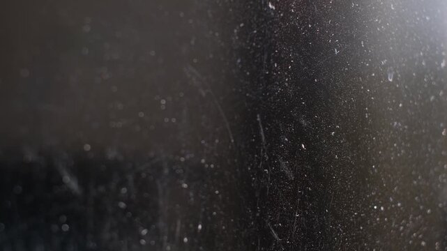 Close-up of dust particles and scratches on a digital display