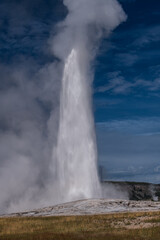 The crown jewel of Yellowstone, Old Faithful, erupt in a breathtaking spectacle of boiling water and billowing steam