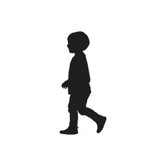 Silhouette of a young child walking with a slight forward lean against a white background in a studio shot