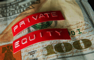 Closeup of Private Equity labels on a US hundred dollar bill