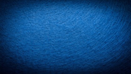abstract background of blue felt fabric texture with dark vignette and space for text