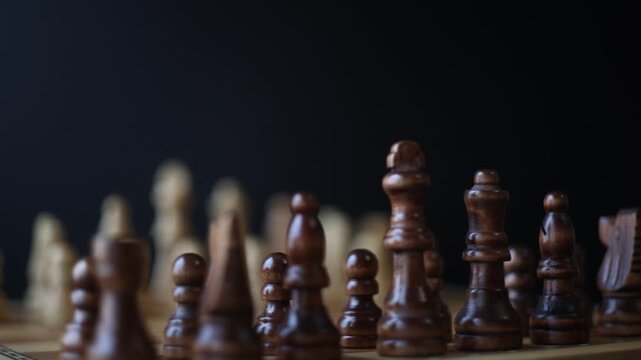 Rotating chessboard with strategically placed pieces in motion, depicting the eternal struggle between black and white factions in cerebral gameplay.