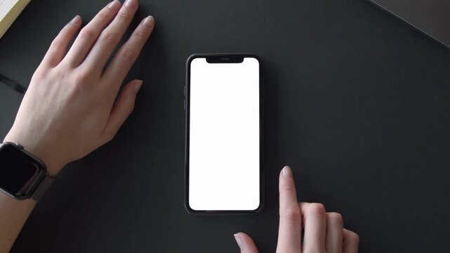 Finger tapping blank screen on modern phone for app demo, website ad, or UI product showcase video with hand wearing smart watch for tech presentation - Powered by Adobe