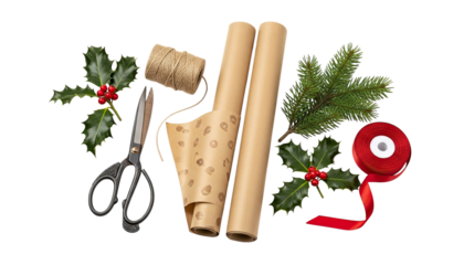 Festive holiday gift wrapping materials with brown kraft paper rolls, red ribbon, scissors, twine, and natural decorations like holly and pine isolated on a black background