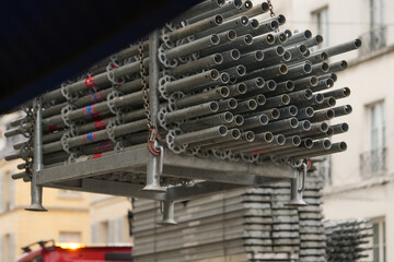 Row of stacked metal scaffolding at construction site
