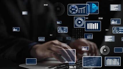 A focus on hands typing on a laptop with floating digital graphics and data visualizations emphasizing technology, analysis, and modern workspace creativity. Xenic