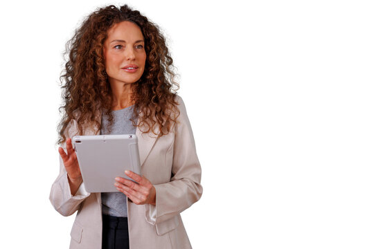 Professional woman with curly hair holding a tablet, managing business, working with digital technology, isolated on transparent background - Powered by Adobe