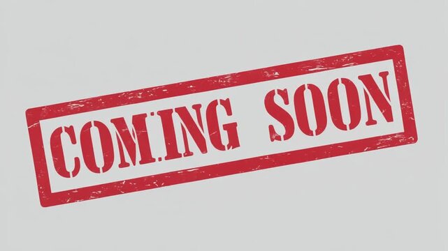 Red grunge rubber stamp with coming soon text on gray background.